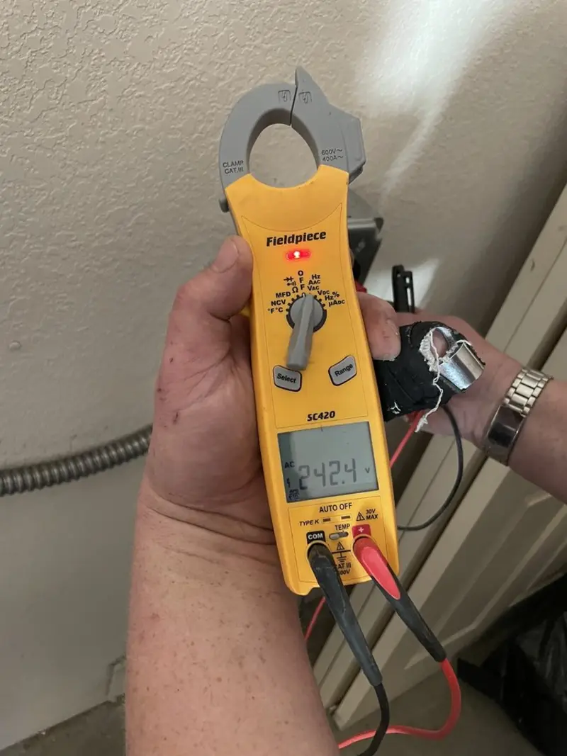Voltage testing with clamp meter during Electrical Installation Services in Rensselaer